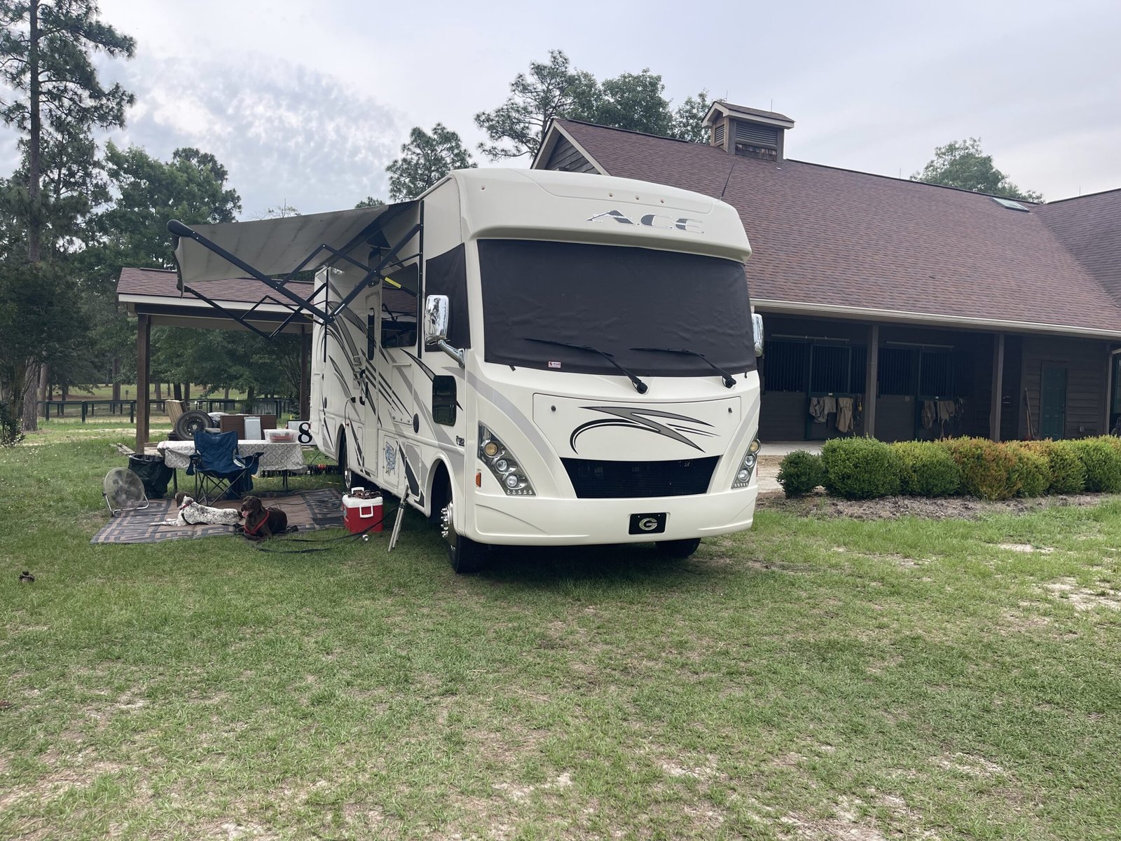 RV parked near a carriage house at Stable View Equestrian