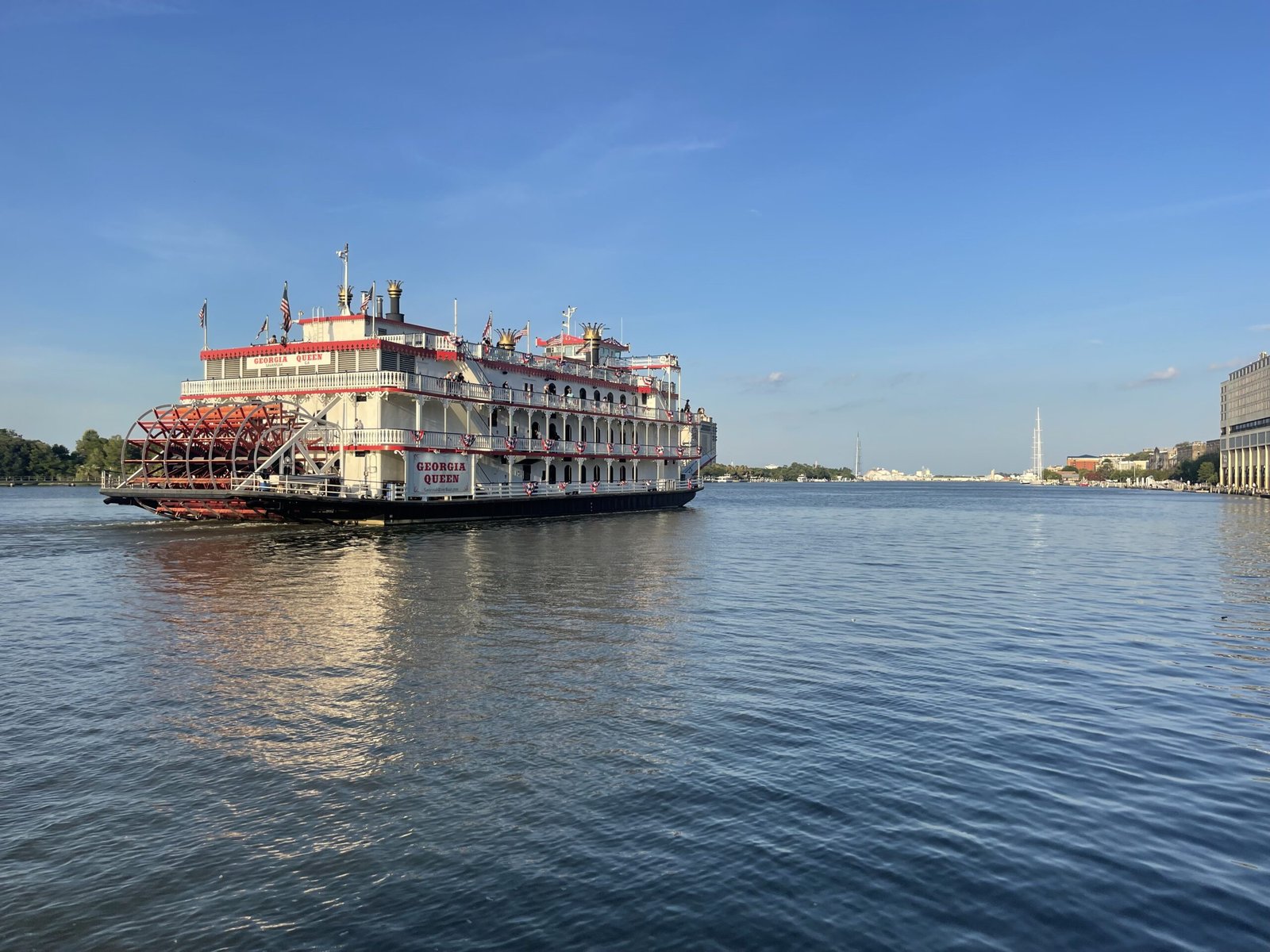 Georgia Queen riverboat on the Savannah River with the Talmadge Bridge behind it