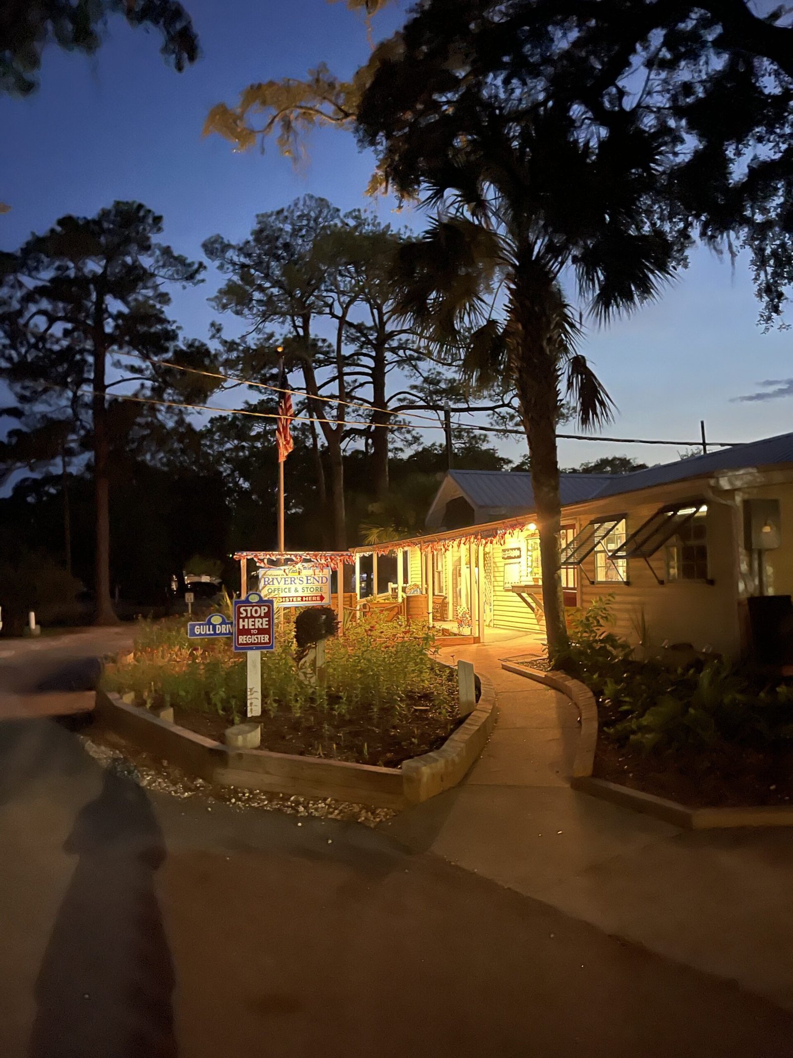 River's End Campground office and store sign lit up at dusk on Tybee Island